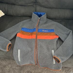 Cotopaxi Gray Jacket with Orange and Blue Accents
